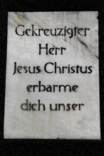 Inscription on the base of a wayside cross