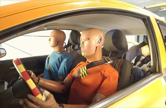 Crash test dummies in a car