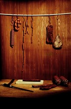 Still life in a butcher's store with a wooden ambience with cutting tools