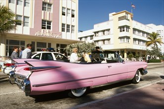 Pink Cadillac convertible parked on Ocean Drive