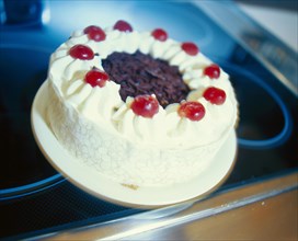 Black Forest cherry cake on a stove