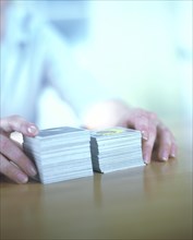Hands with two stacks of memory cards