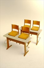 Old school desks with orange chairs