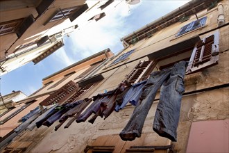 Clothes hanging to dry in an alley of the historic town centre of Rovinj