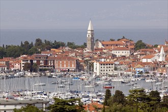 Marina on the Adriatic coast with the historic town centre of Izola