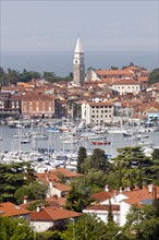 Marina on the Adriatic coast with the historic town centre of Izola