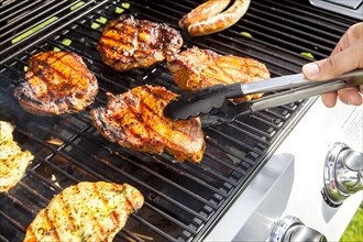 Pork steaks on a gas grill