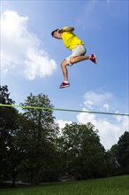 Athlete jumping on a slackline