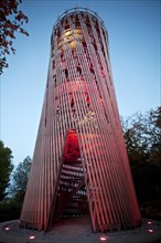 Illuminated Juebergturm tower during the Lichtgarten Sauerlandpark event