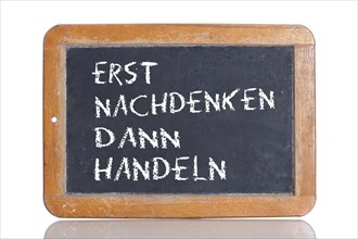 Old school blackboard with the phrase ERST NACHDENKEN DANN HANDELN