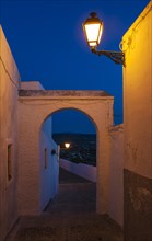 Alley at dusk in the whitewashed village of Arcos de la Frontera