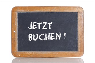 Old school blackboard with the words JETZT BUCHEN!