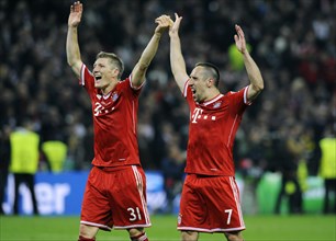 Bastian Schweinsteiger and Franck Ribery cheering jubilantly at the end of the game