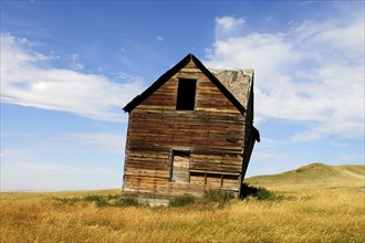 Abandoned and decaying house on the prairie