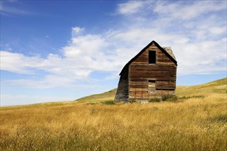 Abandoned and decaying house on the prairie