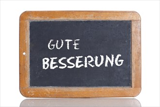Old school blackboard with the words GUTE BESSERUNG