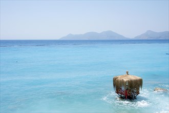 Waterfront hut on the beach in the turquoise water of Lykia World Village Hotel Resort