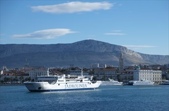 Ferry in the harbour in front of the historic town centre