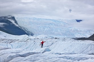 Mountaineer standing on a glacier tongue