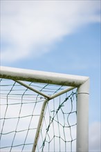 Blue sky and detail of football goal