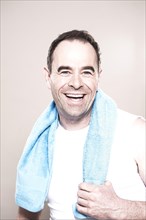 Man with a towel around his neck