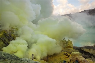 Sulfur miners mining sulfur at Ijen Volcano