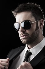 Man wearing sunglasses with stubble