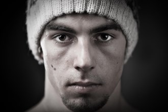 Young man wearing a knitted woollen beanie