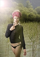 Woman standing between the reeds