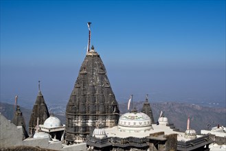 Domes and Shikhara towers of the temple on the sacred mountain of Girnar