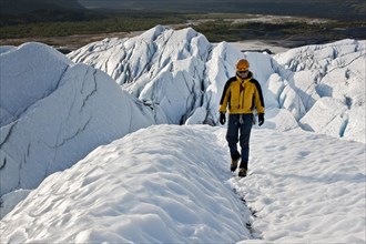 Mountaineer hiking along Matanuska Glacier