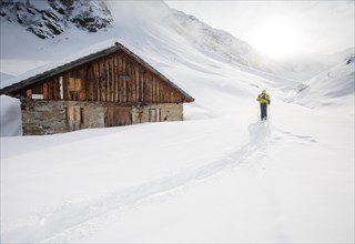 Ski walker at a mountain hut