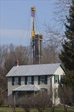 A natural gas well being drilled near a house in rural Lycoming County in preparation for hydraulic fracturing or fracking