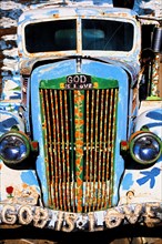 Old truck painted with religious slogans
