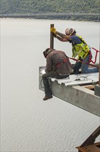 Construction workers working on the Poughkeepsie Bridge