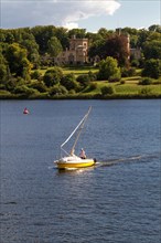 Sailboat on Lake Glienicke in front of Schloss Babelsberg Castle
