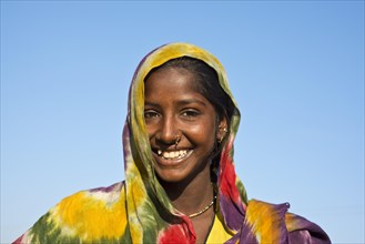 Young Indian woman with colourful scarf