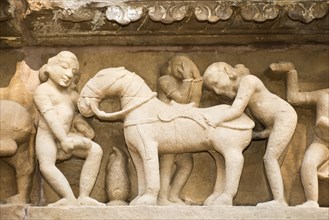 Relief on the outside the Lakshman Temple displaying a sodomist scene of men copulating with a horse