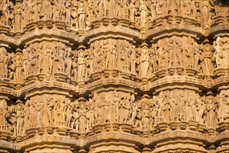 Relief sculptures of gods and men on the facade of the Lakshman Temple