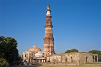 Victory column and minaret of Qutb Minar from the Islamic ruler Qutb-ud-din Aibak and the Quwwat-ul-Islam Masjid Mosque