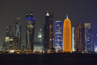 Skyline of Doha at night with the Al Bidda Tower