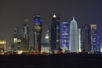 Skyline of Doha at night with the Al Bidda Tower