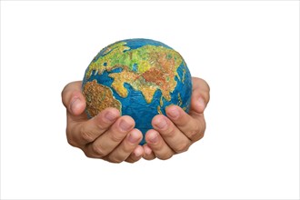 Girl's hands are holding a globe