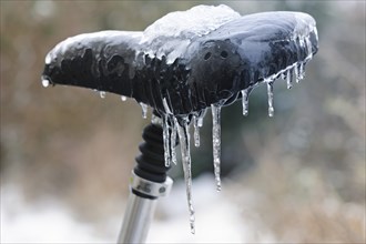 Icicles on a bicycle saddle after freezing rain