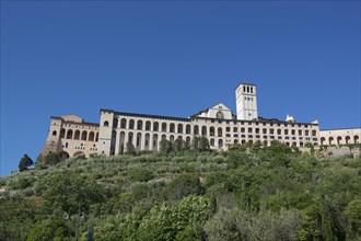 Monastery of St. Clare of Assisi with the Basilica of San Francesco at the foot of Monte Subasio