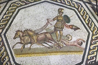 Achilles in his chariot dragging the corpse of Hector