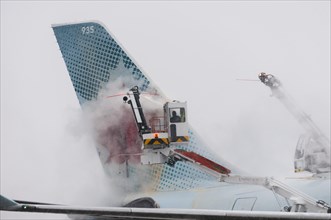 Tail of an Airbus A330-343x from Air Canada being de-iced at Frankfurt Airport
