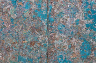Boat hull with residues of turquoise paint
