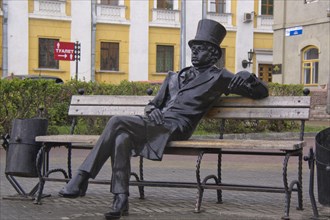 Bronze sculpture of a man with a top hat