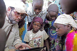 Children during Koran lessons with a notebook